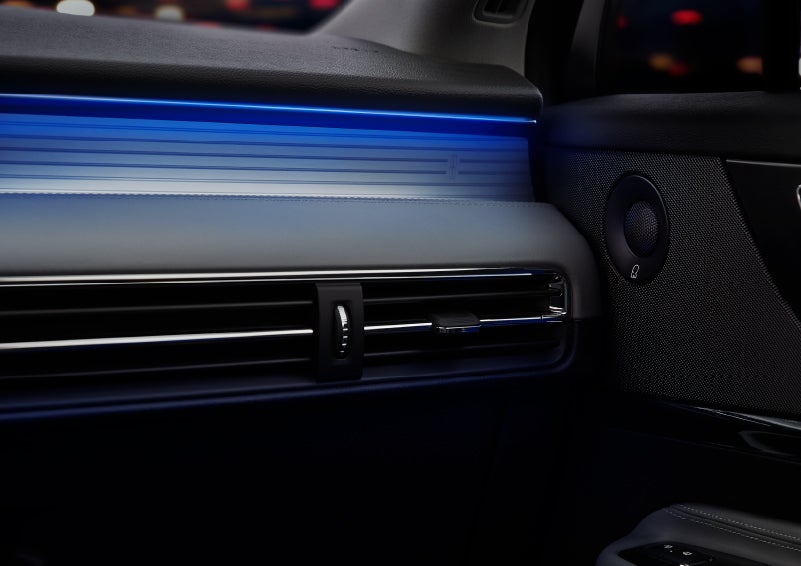 A thin available ambient blue lighting illuminates the pinstripe aluminum under an ebony dashboard, emitting a cool energy | Pugmire Lincoln of Marietta in Marietta GA