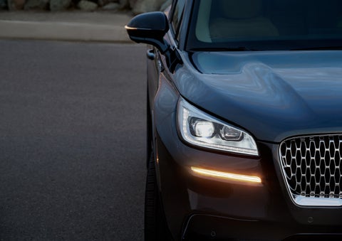 The turn signal on the front fascia is a bold sunset orange stroke of brilliance against a Flight Blue exterior | Pugmire Lincoln of Marietta in Marietta GA