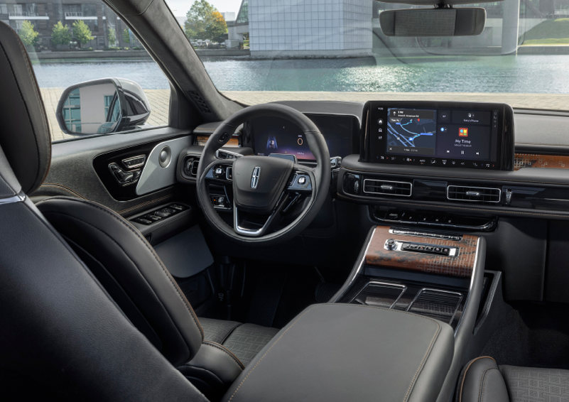 The interior of the 2025 Lincoln Aviator® SUV is shown parked with a view of a harbor through the windshield. | Pugmire Lincoln of Marietta in Marietta GA