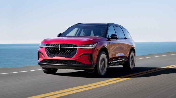 A 2025 Lincoln Nautilus® SUV is being driven on a seaside roadway. | Pugmire Lincoln of Marietta in Marietta GA