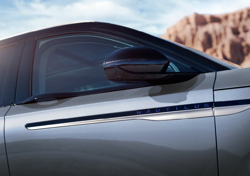 Blue lettering on the side of the vehicle that reads nautilus indicates the available hybrid powertrain. | Pugmire Lincoln of Marietta in Marietta GA