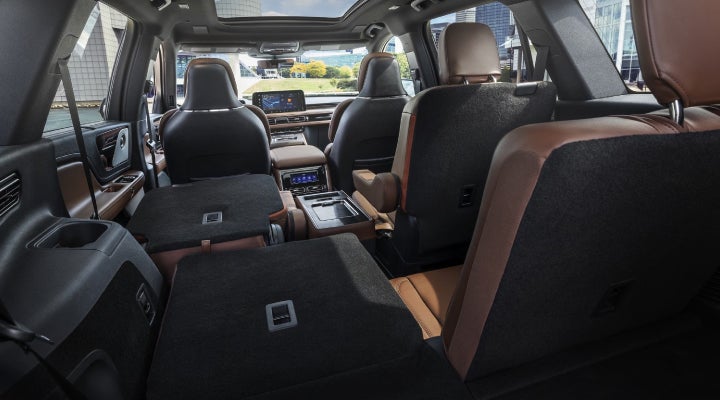 One side of the PowerFold® third-row seat and a second-row seat are folded forward in the 2026 Lincoln Aviator® SUV. | Pugmire Lincoln of Marietta in Marietta GA