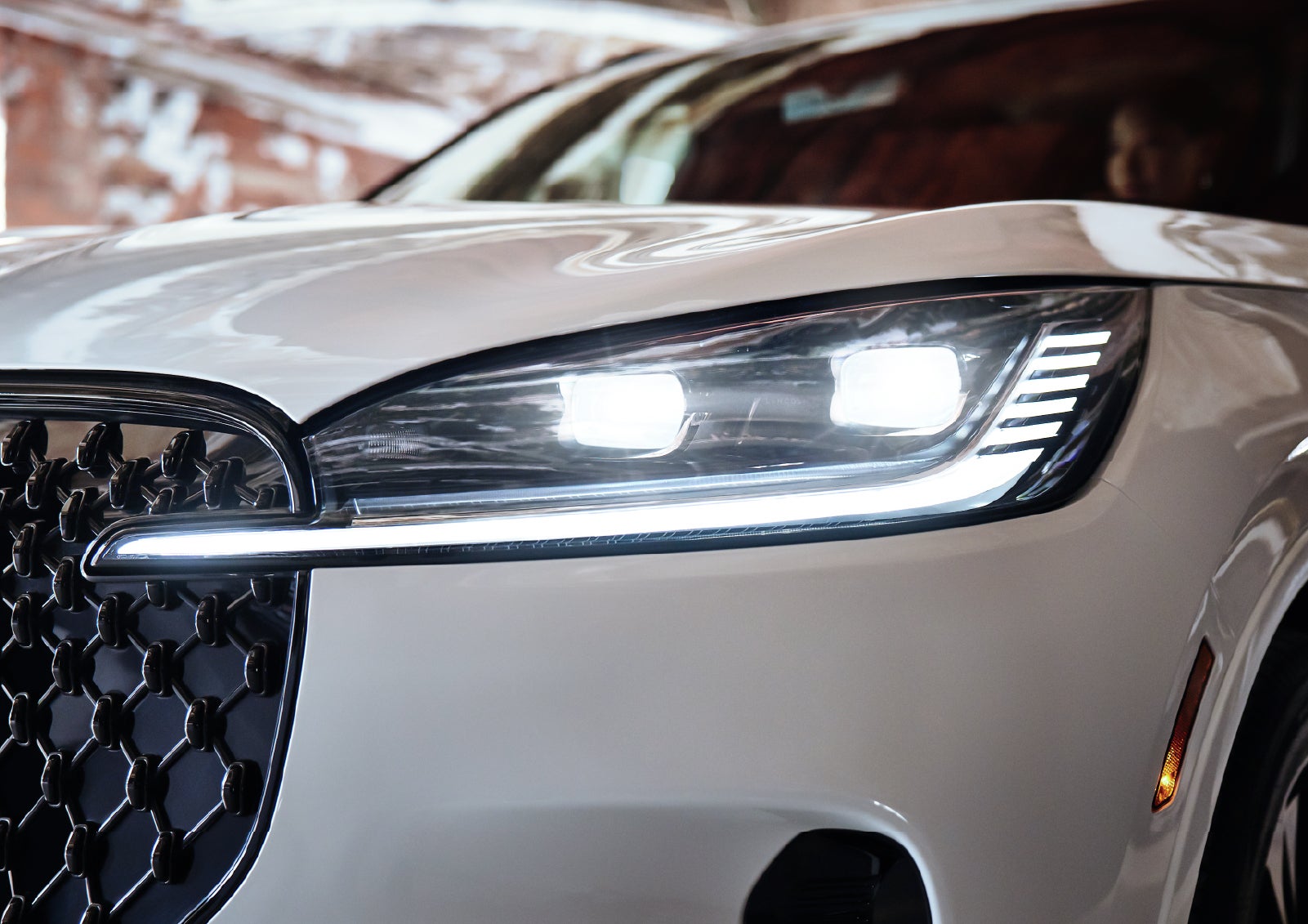 A close-up of a headlamp on the 2027 Lincoln Aviator® SUV is shown. | Pugmire Lincoln of Marietta in Marietta GA