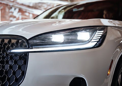 A close-up of a headlamp on the 2027 Lincoln Aviator® SUV is shown. | Pugmire Lincoln of Marietta in Marietta GA