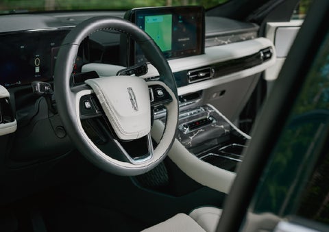 The leather-trimmed steering wheel of a 2027 Lincoln Aviator® Black Label™ SUV. | Pugmire Lincoln of Marietta in Marietta GA