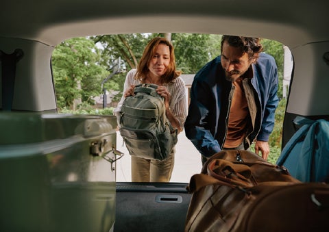 A couple loads luggage into the rear of a 2027 Lincoln Aviator® Black Label™ SUV..e 202 | Pugmire Lincoln of Marietta in Marietta GA